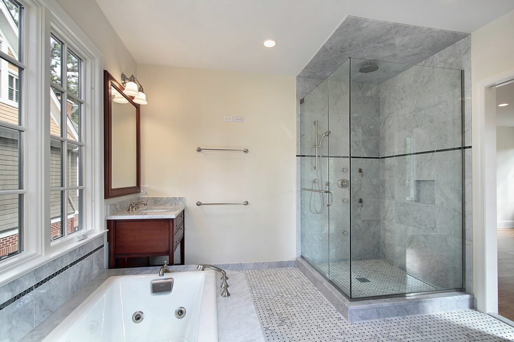 glass shower enclosure, frameless glass shower, modern bathroom with glass shower, custom glass shower doors, bathroom renovation with glass enclosure, walk-in glass shower design, glass shower enclosure Brampton, glass shower Mississauga, GTA glass shower installation, sleek bathroom glass shower